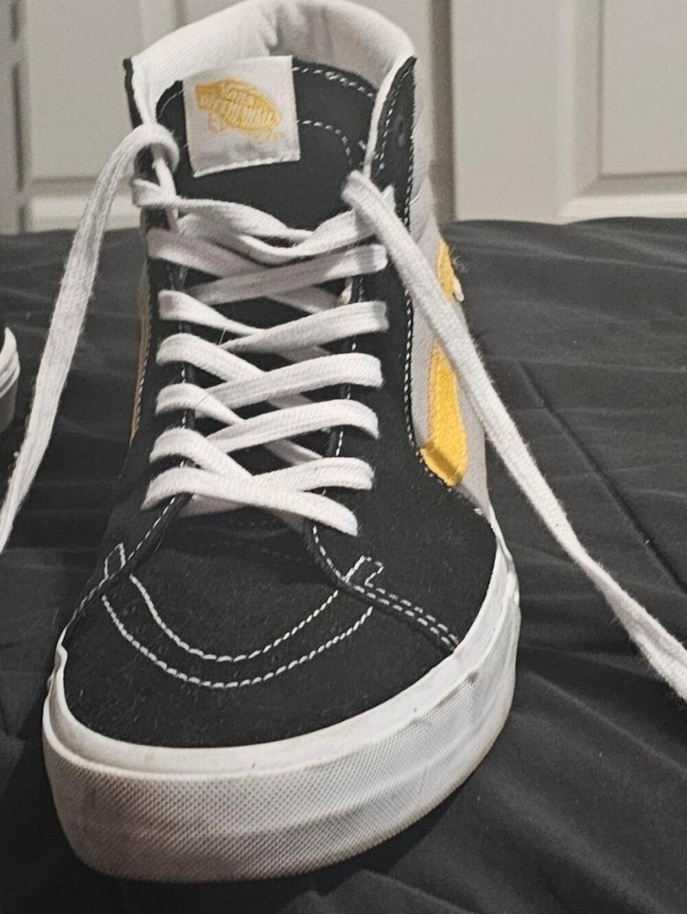 Vans Black High-Top Sneakers with Yellow Stripe